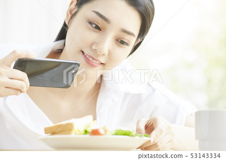 Woman cooking photography 53143334