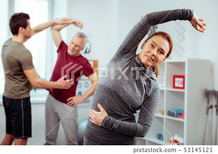 Pleasant nice positive woman looking at you 53145121