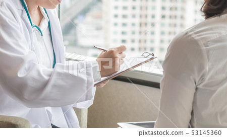Doctor diagnostic examining woman patient health 53145360