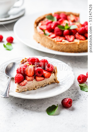 Piece of berry tart with raspberries, strawberries 53147426