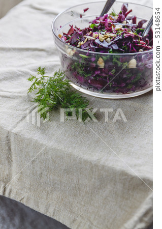 Fresh blue cabbage salad with herbs and nuts in a Fresh blue cabbage salad with herbs and nuts in a 53148654