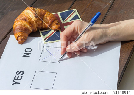 Female hand filled NO  in the referendum 53148915