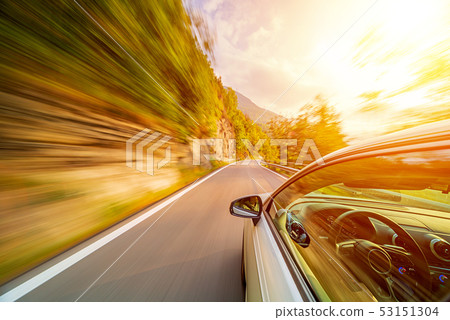 Car in motion blur driving in the Mountains Car in motion blur driving in the Mountains 53151304