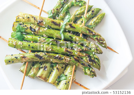 Grilled asparagus rafts with sesame seeds 53152136