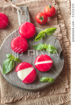 Small snack cheeses on the wooden board Small snack cheeses on the wooden board 53152155