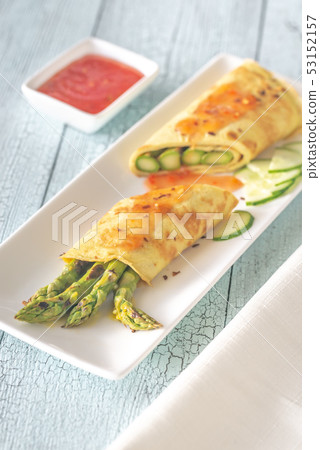 Coconut crepes with grilled asparagus 53152157