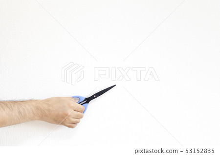 Male hand with scissors 53152835