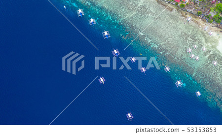 Aerial view of Filipino boats floating on sea. Aerial view of Filipino boats floating on sea. 53153853