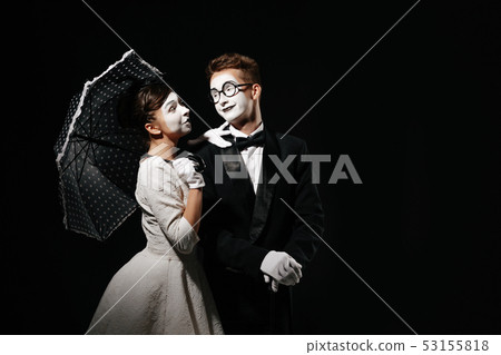 portrait of couple mime on black background. 53155818