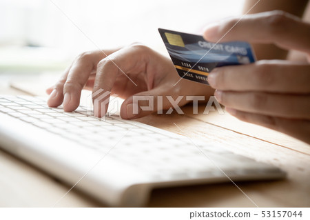 Close up hand of businessmen are buying online 53157044