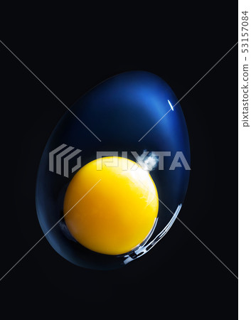Raw broken egg closeup on black background. Macro. The concept of the origin of life 53157084