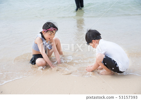 Children playing in the sea Children playing in the sea 53157393