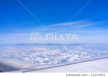 Airplane wing sky white clouds airplane aircraft wing window 53157625