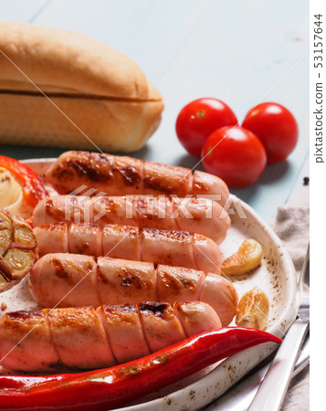 Grilled chicken sausages close up Grilled chicken sausages close up 53157644