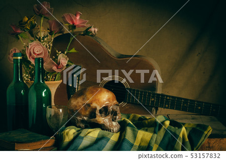 Human skull and flower vase old treasure on wooden 53157832