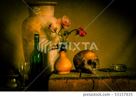 Human skull and flower vase old treasure on wooden 53157835