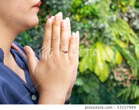 Young woman praying hand on Temple,Background plan Young woman praying hand on Temple,Background plan 53157949