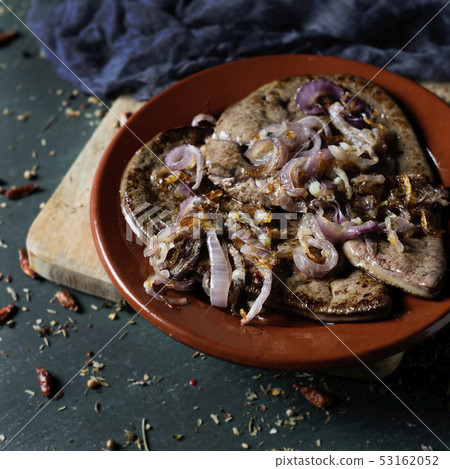 higado encebollado, a spanish recipe of cow liver. 53162052