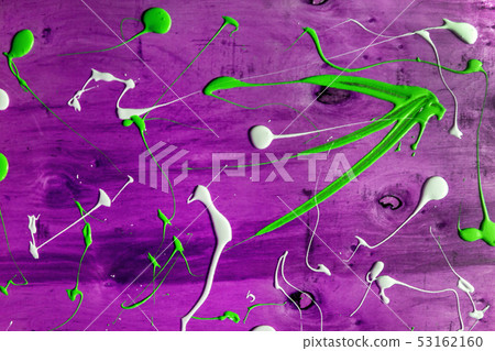 Artist working wooden table top with paint  marks 53162160