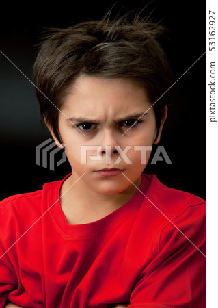 angry young boy in dark background angry young boy in dark background 53162927