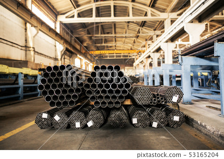 Metallic pipes on warehouse, rows of metal pipes on industrial warehouse. Industrial interior, Metallic pipes on warehouse, rows of metal pipes on industrial warehouse. Industrial interior, 53165204