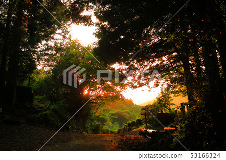 Mountain road at sunset 53166324