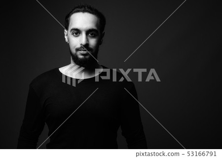 Young bearded Indian man in black and white Young bearded Indian man in black and white 53166791