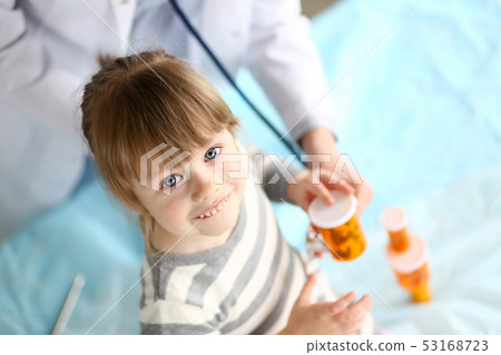 Cute little girl at doctor reception getting medications prescription 53168723