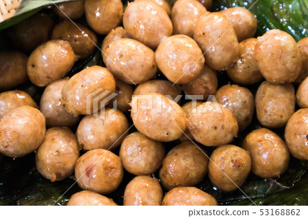 Close up of Grilled Thai style sausages on banana Close up of Grilled Thai style sausages on banana 53168862