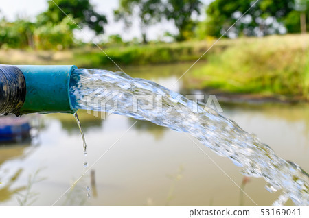 Agriculture blue pipe with groundwater gushing Agriculture blue pipe with groundwater gushing 53169041