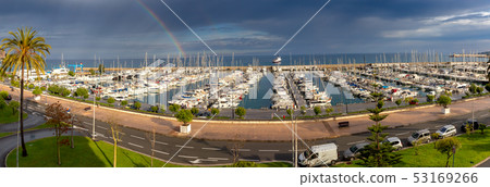 Menton. Panoramic view of the harbor with yachts and the city embankment. Menton. Panoramic view of the harbor with yachts and the city embankment. 53169266