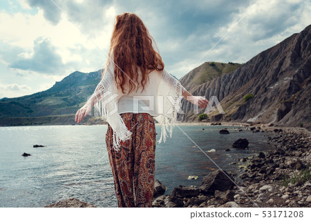 Beautiful boho styled model wearing white crochet Beautiful boho styled model wearing white crochet 53171208
