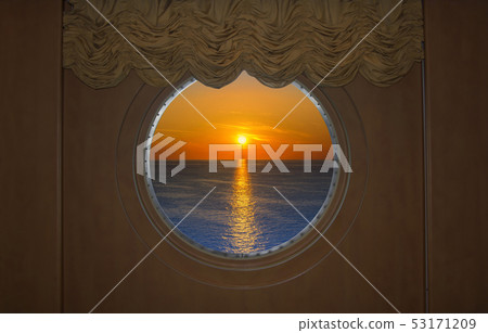 Beautiful Sunset Seen Through a round Ship Beautiful Sunset Seen Through a round Ship 53171209