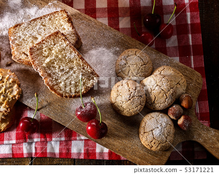 Oatmeal cookies snack and cherry breakfast close up Oatmeal cookies snack and cherry breakfast close up 53171221