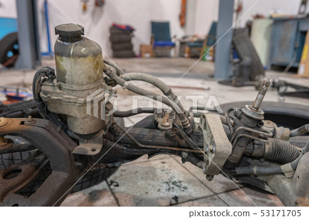 Repair and check car in repair shop.  53171705