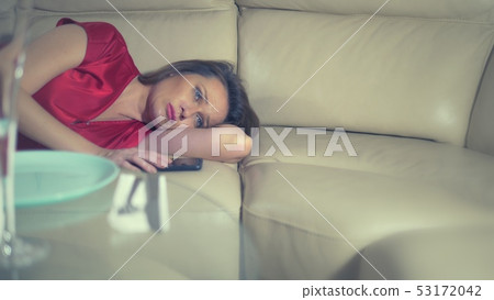 heartbroken the killed woman cries at home alone at the table served for a romantic date for two heartbroken the killed woman cries at home alone at the table served for a romantic date for two 53172042