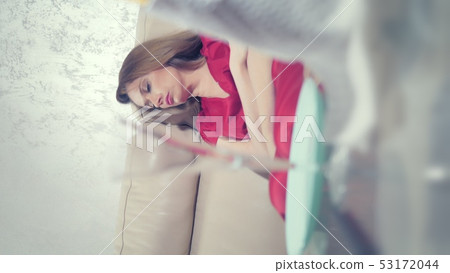 vertical video. heartbroken the killed woman cries at home alone at the table served for a romantic vertical video. heartbroken the killed woman cries at home alone at the table served for a romantic 53172044