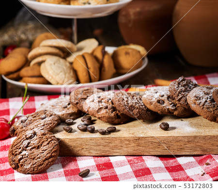 Oatmeal chocolate cookies with coffee grains and cherry. Sun flare 53172803