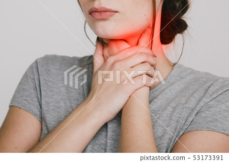 Sore throat. Woman holding hands on her throat. Heartburn concept. Sore throat. Woman holding hands on her throat. Heartburn concept. 53173391
