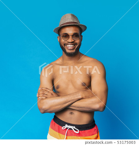 Confident shirtless black guy smiling at camera with crossed arms Confident shirtless black guy smiling at camera with crossed arms 53175003