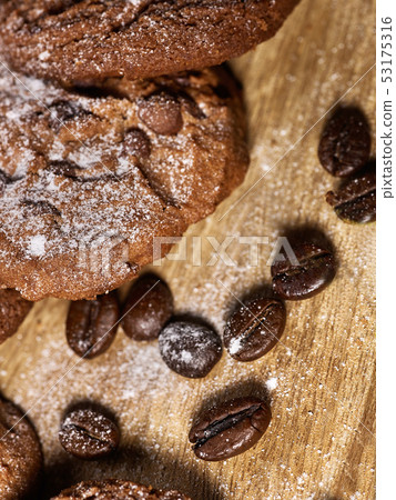 Oatmeal chocolate cookies with coffee grains and cherry. Sun flare 53175316