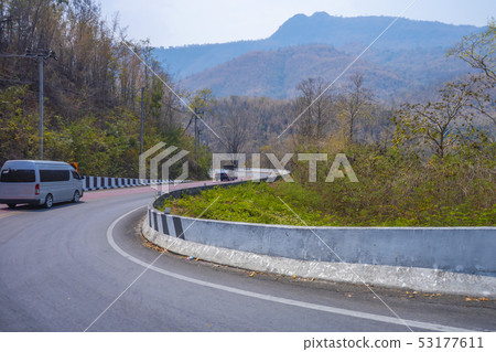 Van on the road down hill with travel Van on the road down hill with travel 53177611