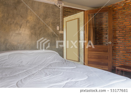 White Bed in Bedroom in Country Loft Interior White Bed in Bedroom in Country Loft Interior 53177681