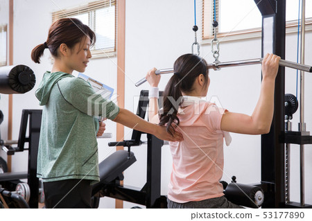 woman receiving personal training woman receiving personal training 53177890