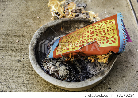 Burning fake gold in the Chinese New Year's Day . Burning fake gold in the Chinese New Year's Day . 53179254
