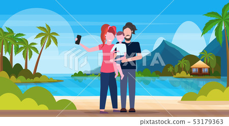 family on beach taking selfie photo on smartphone camera summer vacation concept mother father and 53179363