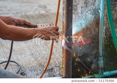 welder man fix the door with weld machine. welder man fix the door with weld machine. 53179366