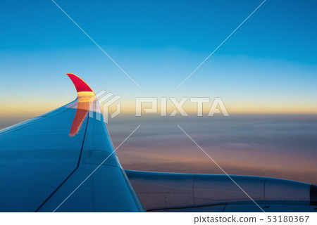 View from airplane window to see sky. 53180367