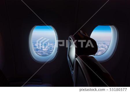 plane seat overlooking the beautiful sky 53180377