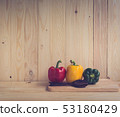 sweet peppers on wooden table background 53180429